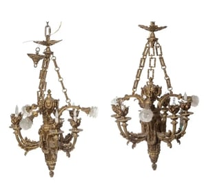 A pair of cast-bronze Empire-style chandeliers