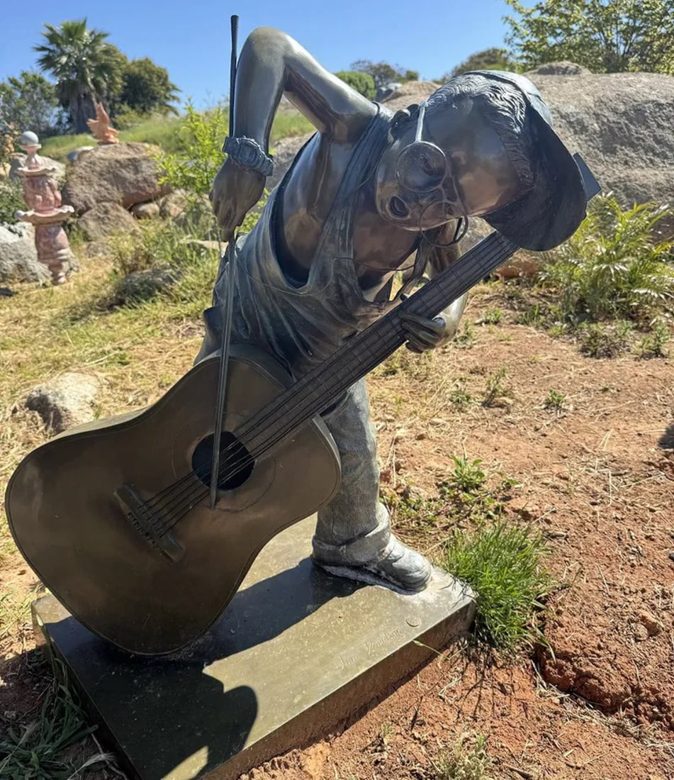 Life Size Bronze Boy Playing Instrument by Jim Davidson (1 of 3)