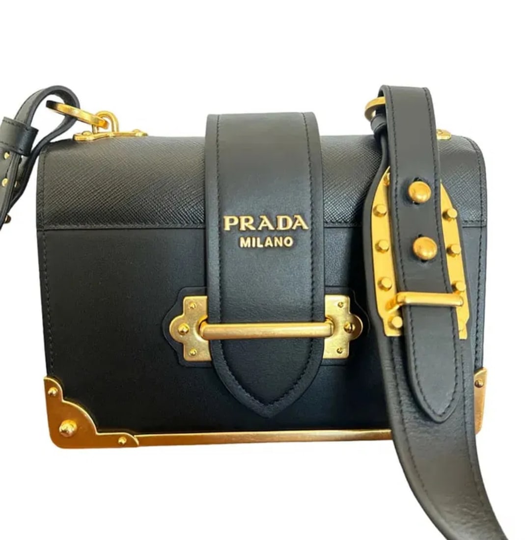 Prada Cashie Leather Black Cross Bag: Size: 7.9 in x 5.9 x 2.8 in - Comes with Box -All sales are final,please inspect all the items before bidding.