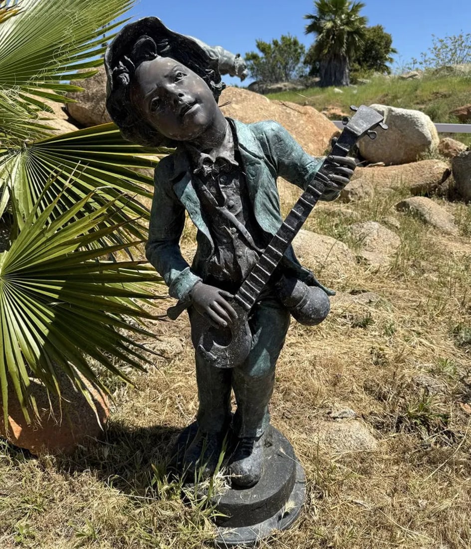 Life Size Bronze Boy Playing Instrument Sculpture: Size:45 in x 15 in