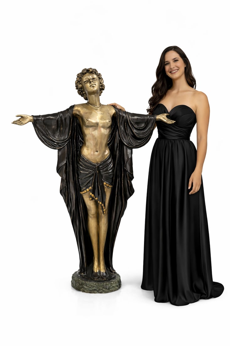 Near Life Size Bronze Neoclassical Figural Sculpture with Outstretched Arms: Size: 54 in tall - This elegant figural sculpture portrays a graceful female form with arms extended outward in a welcoming, expressive gesture. The figure is rendered in warm gilt tones, contrasted b