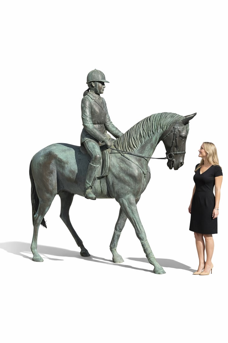 Life Size Horse and Rider Bronze Sculpture: Size: 80” x 80” This stunning bronze sculpture captures the timeless beauty and grace of equestrian tradition. Featuring a poised rider in classic riding attire seated atop a finely detail
