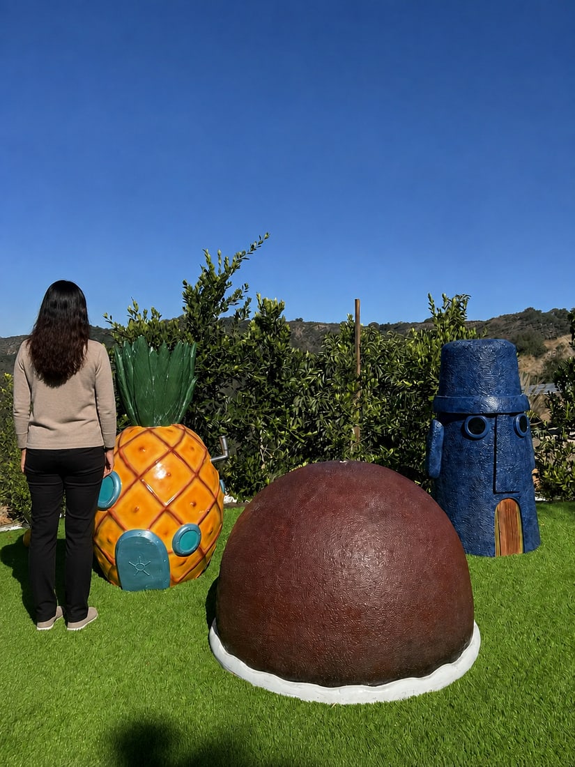 Life Size SpongeBob SquarePants Bikini Bottom House Garden Statues - Set of 3: Large fiberglass garden statues featuring the iconic homes of SpongeBob, Patrick, and Squidward. This set includes a yellow pineapple house with blue windows, a brown rock dome, and a blue Moai-style 