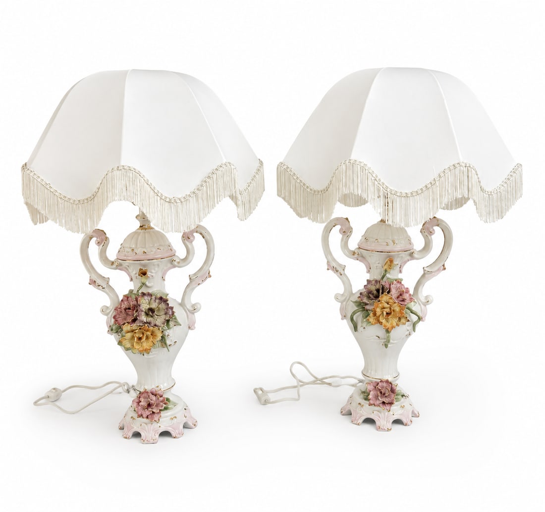 Pair of Vintage Capodimonte Style Porcelain Floral Table Lamps: Size: 34” x 20” Very good condition. Elegant pair of porcelain table lamps with a white base and hand-painted 3D floral accents in pink, orange, and purple. Each lamp has a white fabric