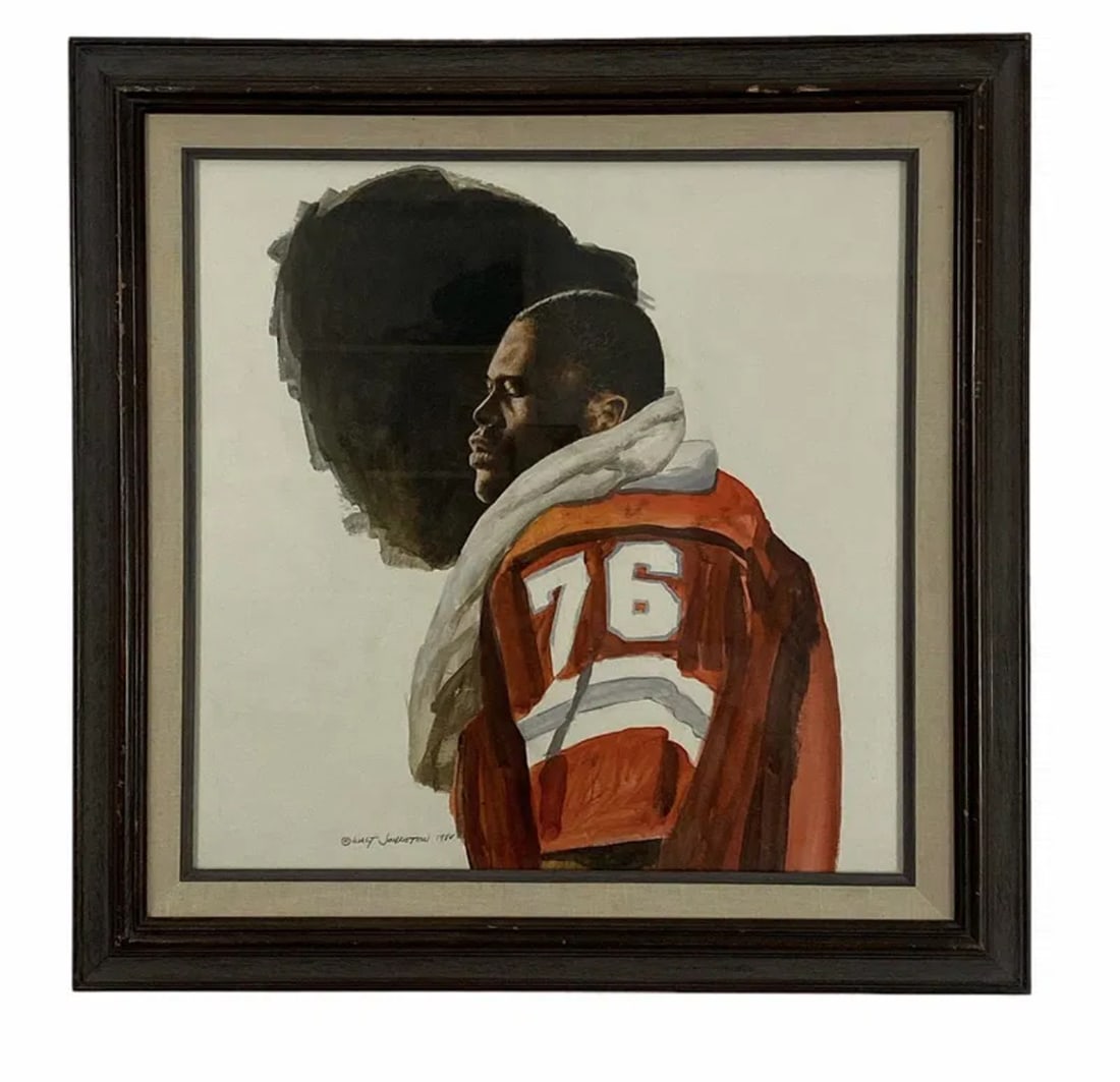 1984 Watercolor Football Art by Walt Johnston: Measurements: 21 in L x 21 in H Walt Johnston ( 1932-2018) was a contemporary realist. He looked at everything in the most modern way, saw the underlying abstract form, then brought that vision to a