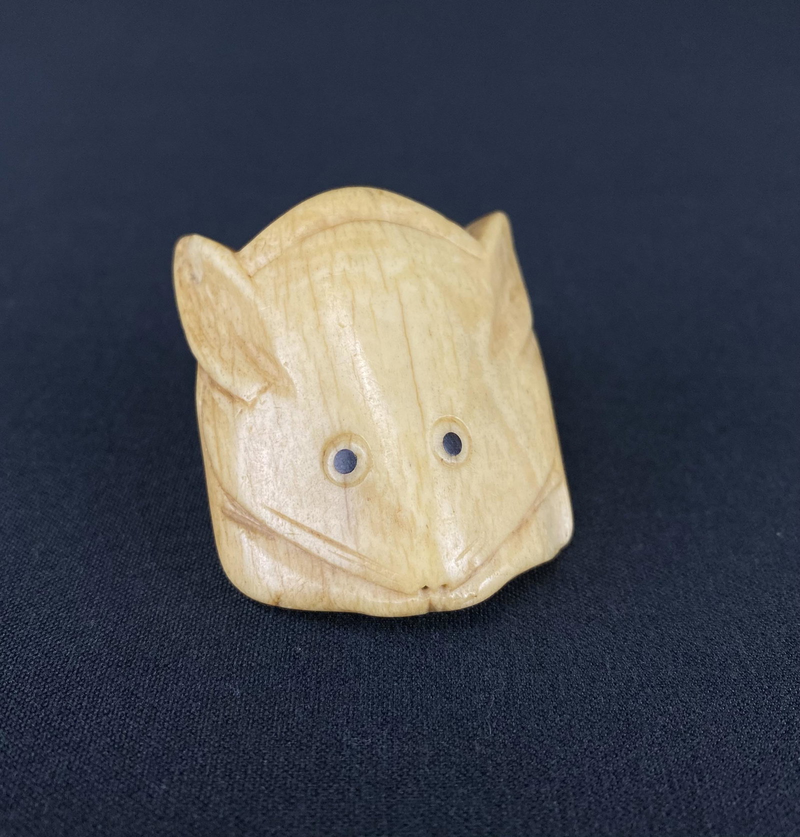 Antique Japanese Bone carving of Rabbit Netsuke: Antique Japanese bone carving of Rabbit. It is of an odd design possibly used as a netsuke. The piece has a nice patina consistent with use. It measures 1.75 inches tall and 1.5 inches wide.