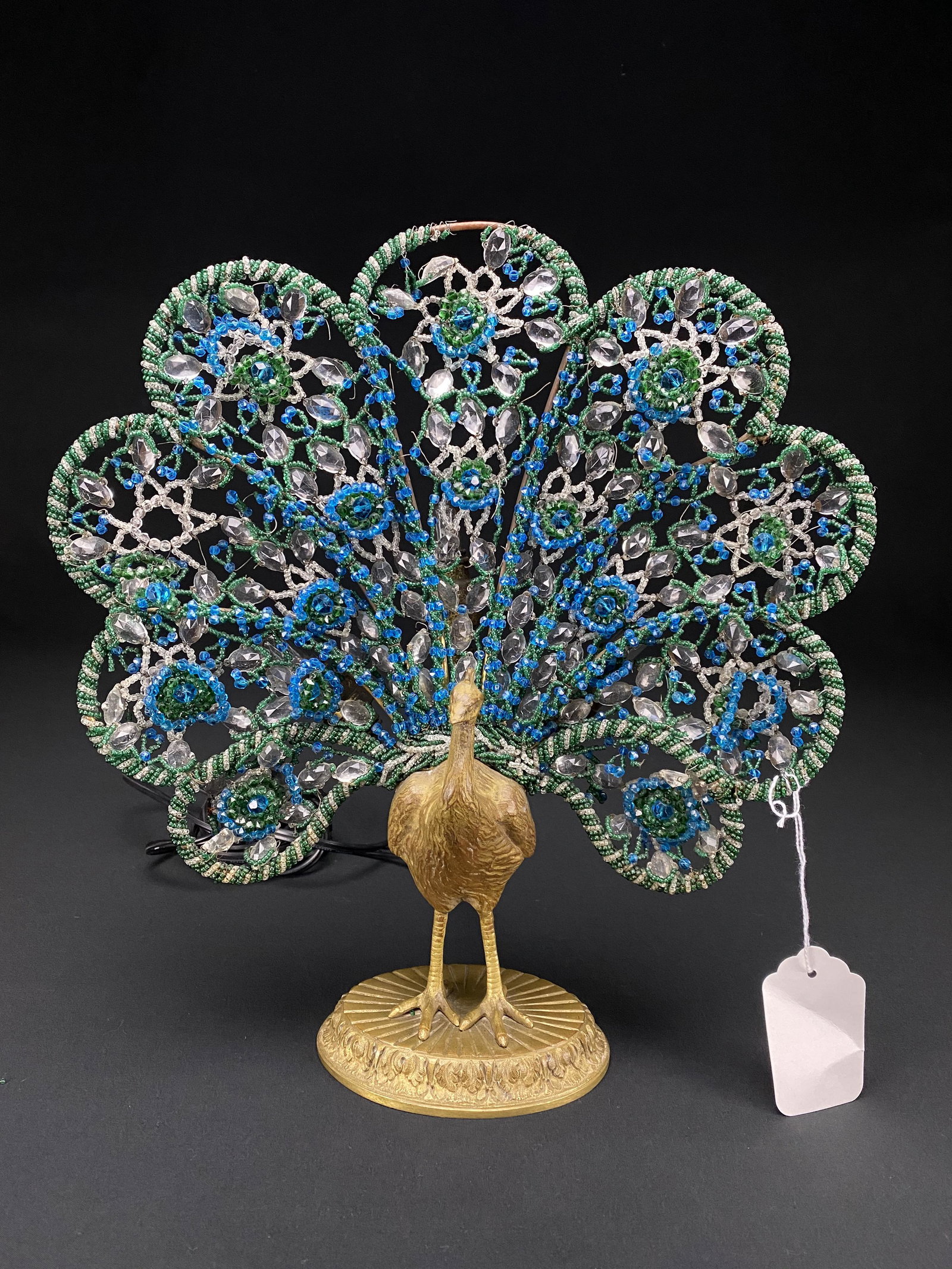 French Art Deco Gilt Bronze Peacock Form Lamp: Art Deco gilt bronze peacock form lamp with Czech beaded glass. This lamp is finely crafted with nice small intricate seed beads. The base is marked Made in France. There are some areas of bead loss a