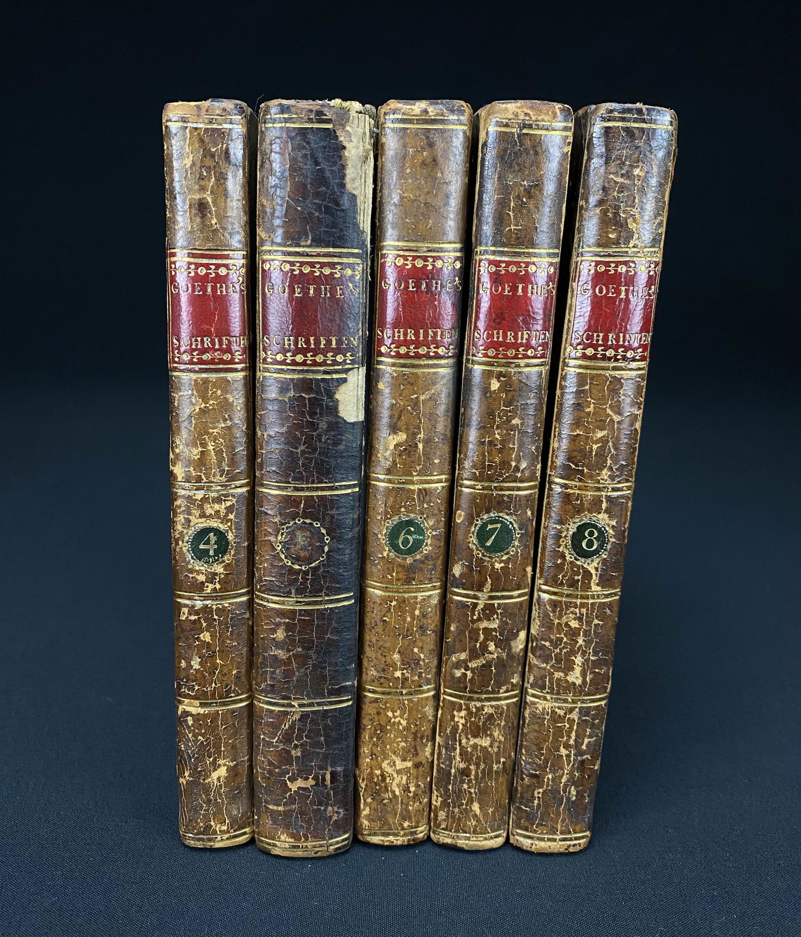 Antique Leather Bound Goethe's "Schriften" Volumes 4-8: Antique leather bound Goethe's "Schriften" volumes 4-8, circa 1790. This book is published by Lepzig: Bey Georg Joachim Goschen, 1790. These books are in good estate condition considering they are 230