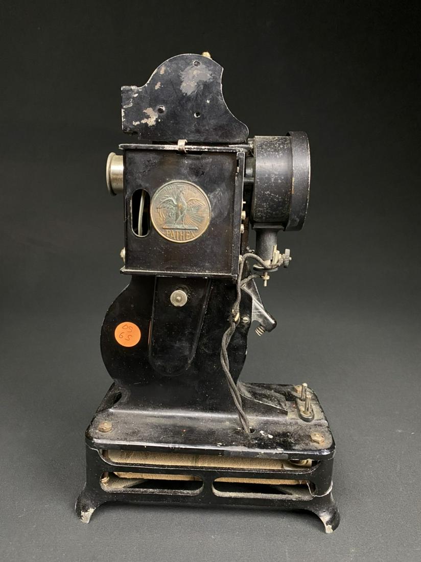 Antique Pathex Movie Projector: Antique Pathex movie projector. The piece is marked "Made in France" and there is a number on a brass plate that reads "16.074".