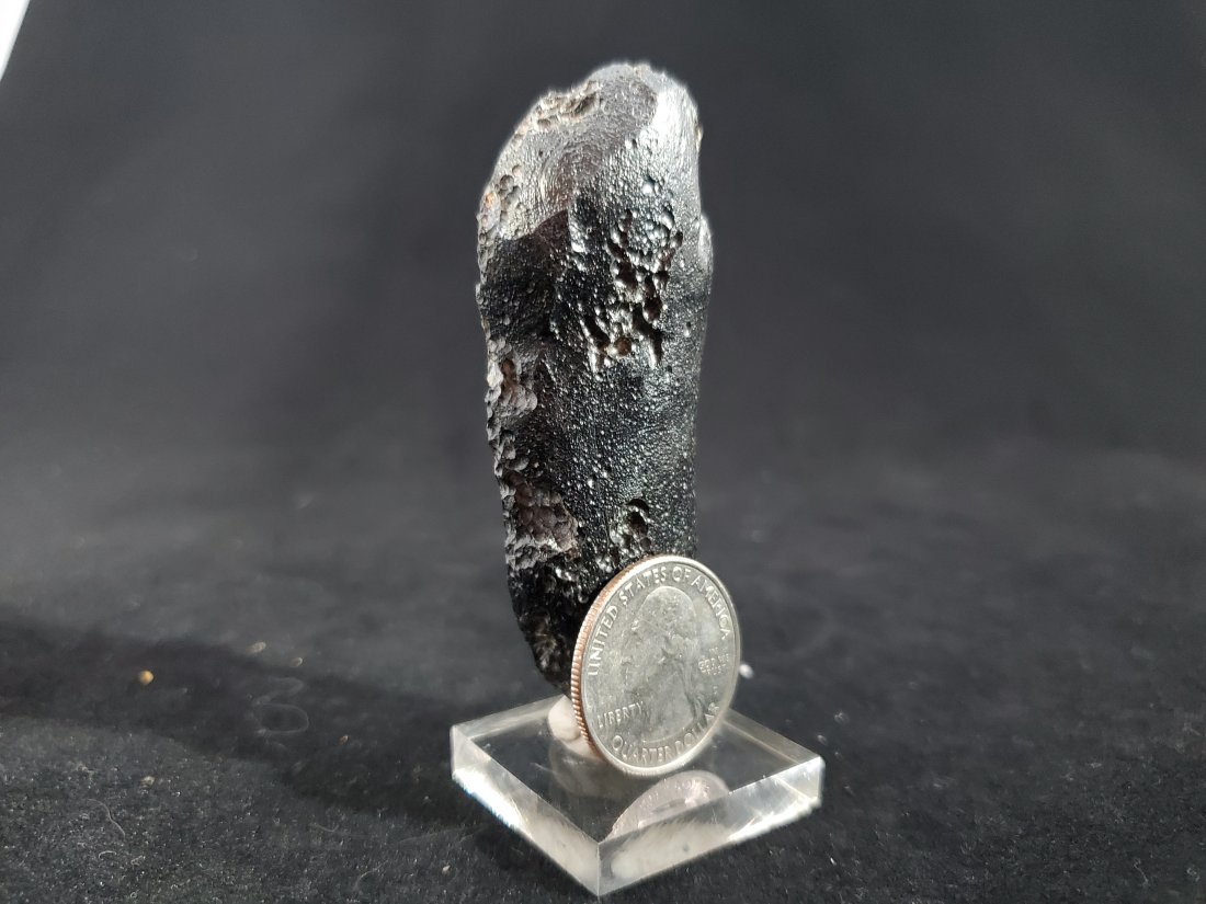 Black Indochinite Tektite Stone from China 56.8 grams: Discovered at Maoming, Guangdong Province, China.This tektite is known as an "Indochinite".Indochinite Tektites are solidified rock, which were fired into the Earth's upper atmosphere by a meteorite i