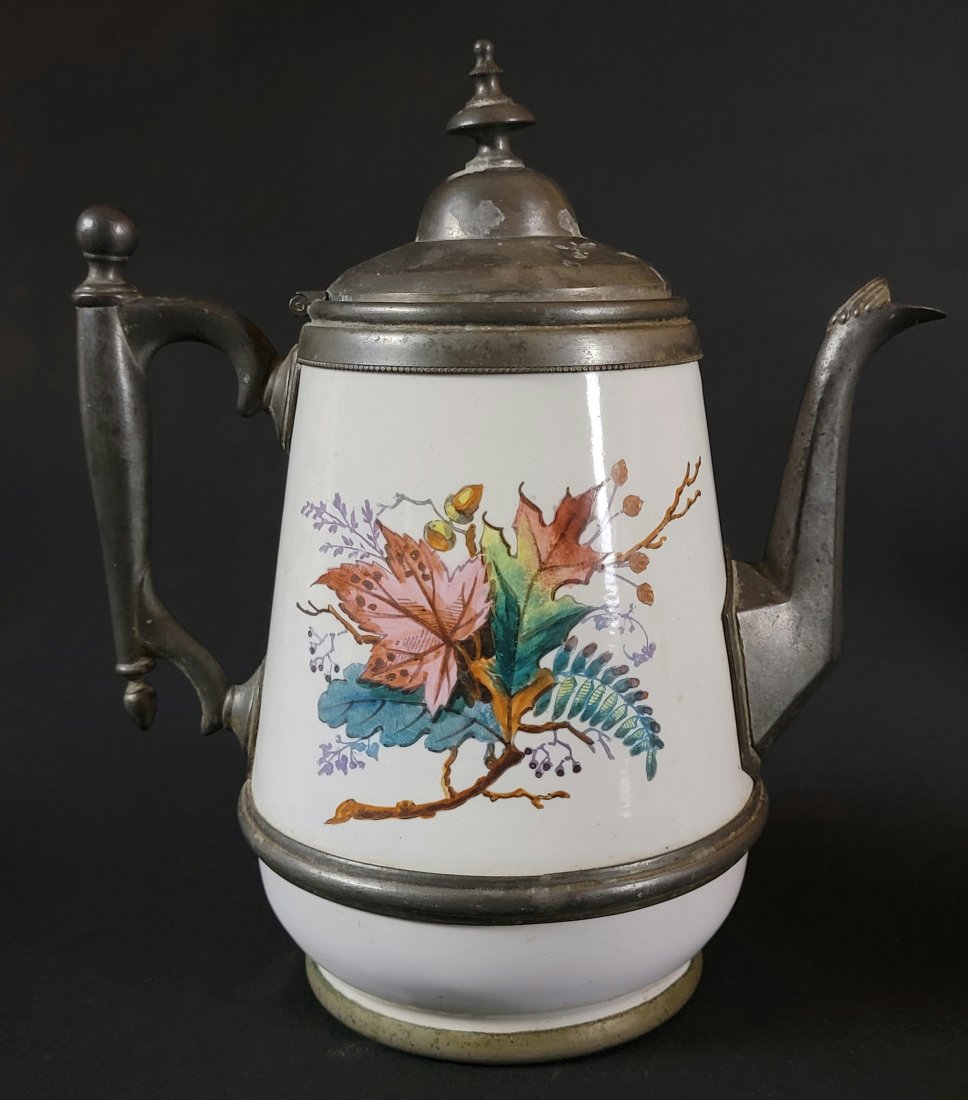 Manning, Bowman & Co. Pewter Trimmed Enamel Tea Pot: Am elegant table accessory by Manning, Bowman & Co., of Meridian, Connecticut. The company was in business from 1849-1945, and through that time achieved international fame. Some of the products manuf