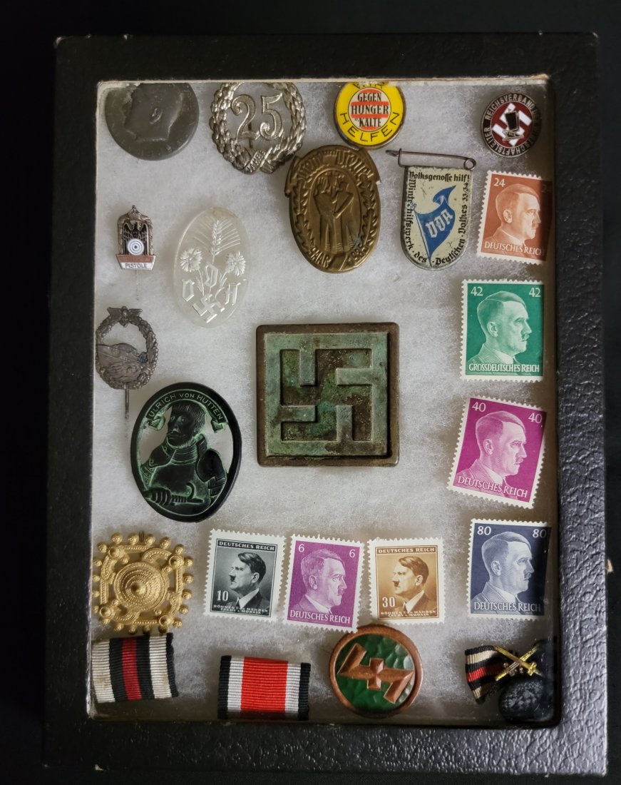 Assorted lot of WWII Era German Stamps - medals - pins: A collection of Third Reich-related, ephemera, housed in a riker display box.