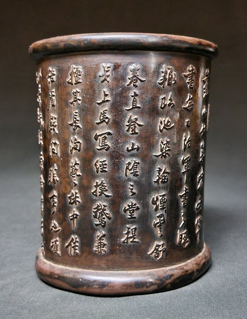 A vintage Chinese brush pot, decorated with Calligraphy: A brush pot with signatures of use, circa 20th Century.