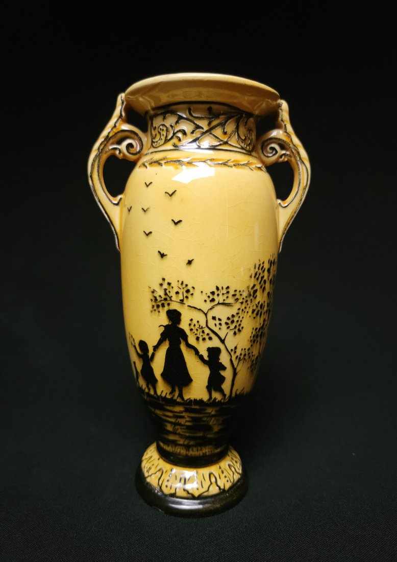 Erphila Art Pottery Vase - Czechoslovakia: This is a very charming Art Pottery vase marked Erphila from Czechoslovakia. The vase is done in soft shades of yellow, and depicts a young mother walking with children in hand, followed by a small do