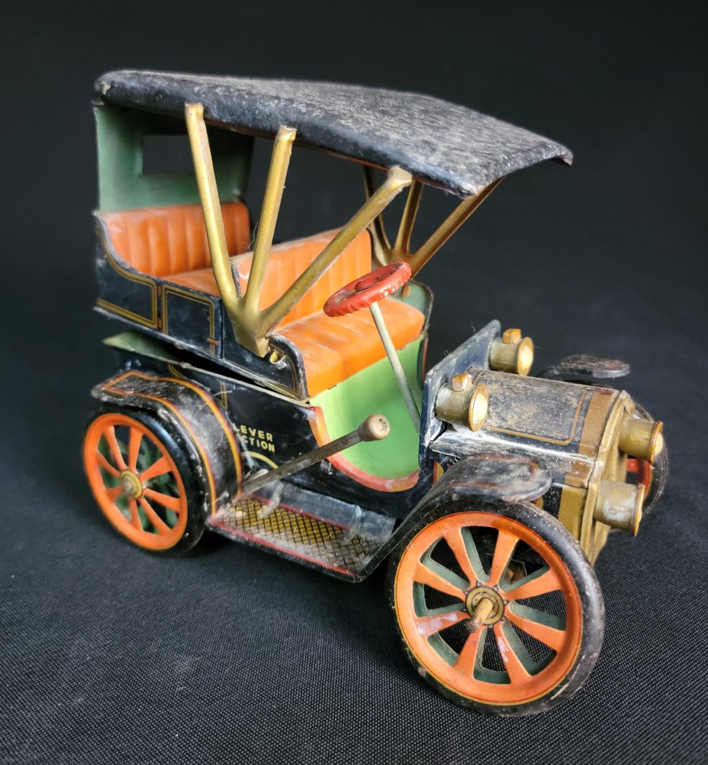 Vintage Lever Action Japanese Tin Car: Vintage Lever Action Japanese Tin Car. Body is splitting. Still held together. Lever action still works. Great candidate for refurbishment.