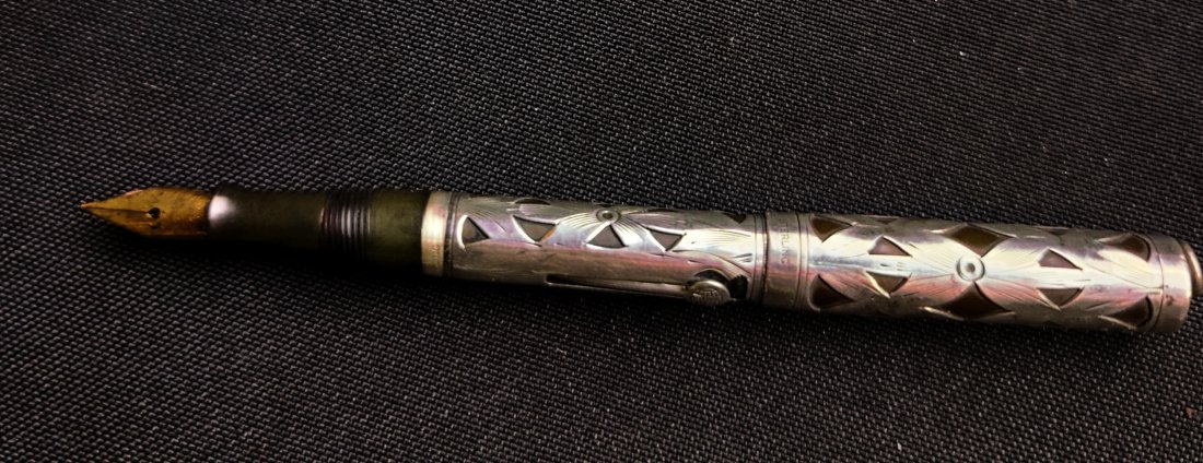 Watermen's Sterling Silver Fountain Pen Circa 1920: Watermen's Sterling Silver Fountain Pen Circa 1920. The model is 452 1/2v. Each Waterman's pen is completely unique never having the exact same design. This pen comes with the original 14k gold flex t