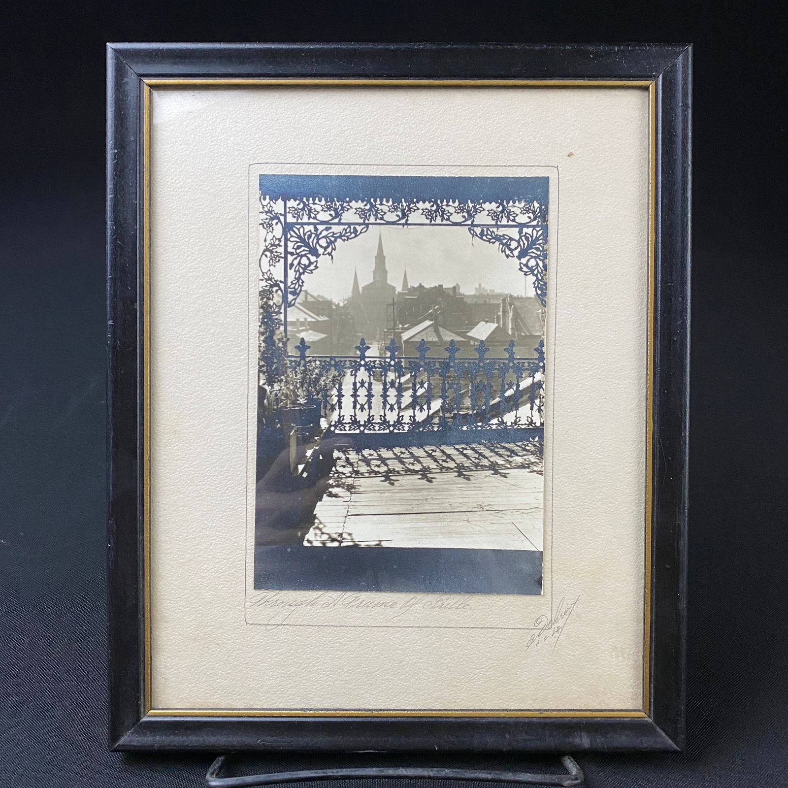 Eugene Delacroix French Quarter New Orleans Photograph titled Through a Frame of Grille: Eugene Delacroix French Quarter New Orleans Photograph titled Through a Frame of Grille. The photograph is in it's original black lacquer framing and custom paper board backing.
