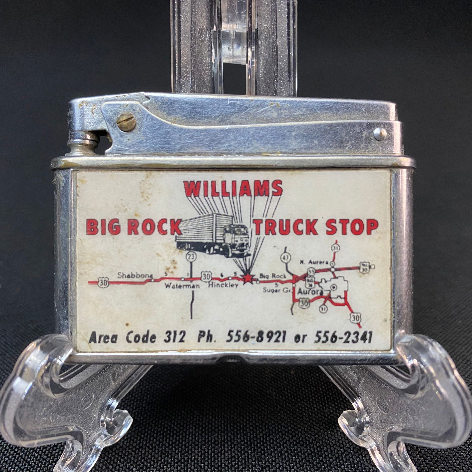 Vernco Lighter Williams Big Rock Truck Stop: Vernco Lighter Williams Big Rock Truck Stop decal on front. Used. Condition is good. Vernco Japan stamped on bottom of lighter. It measures 1 3/4 tall by 2 5/16 wide by 3/8 thick/deep.