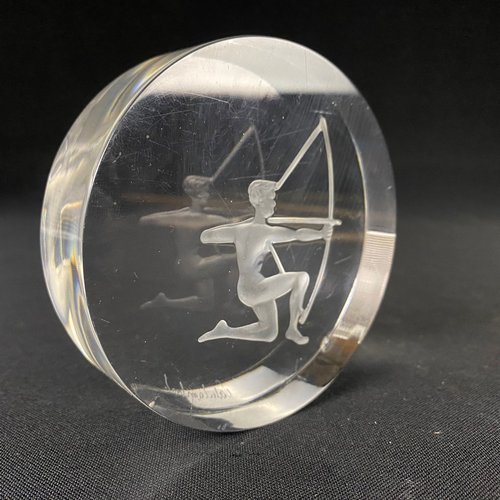Lead Crystal Puck with Engraved and Etched Sagittarius Archer: Lead Crystal Puck with Engraved and Etched Sagittarius Archer. It is in Great condition with some surface scratches, and a couple small chips and knicks along the perimeter. It has a hand engraved sig