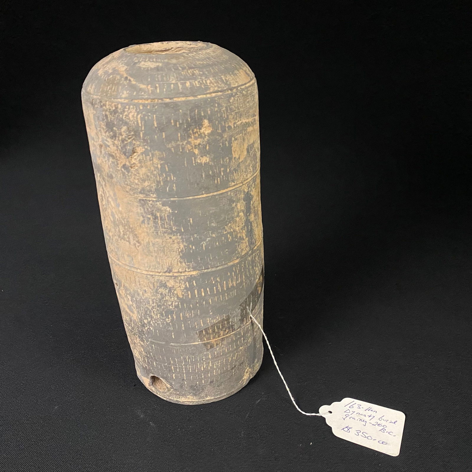 200 B.C. Han Dynasty Burial Granary: 200 B.C. Han Dynasty Burial Granary. This Burial Granary has a sectional design with multiple vertical tallies throughout the piece. It has a hole on the side at the bottom that measures 1/2 in diamet