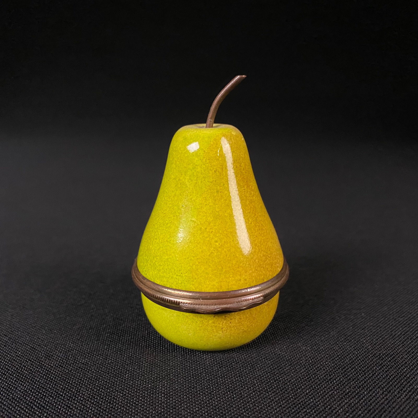 Halcyon Days Enamels Pear Bonbonniere Trinket Box: Halcyon Days Enamels Pear Bonbonniere Trinket Box. Made in England. Condition is Great with no chips or cracks, and only minor surface wear. However, the top portion of the box needs to be reset to th