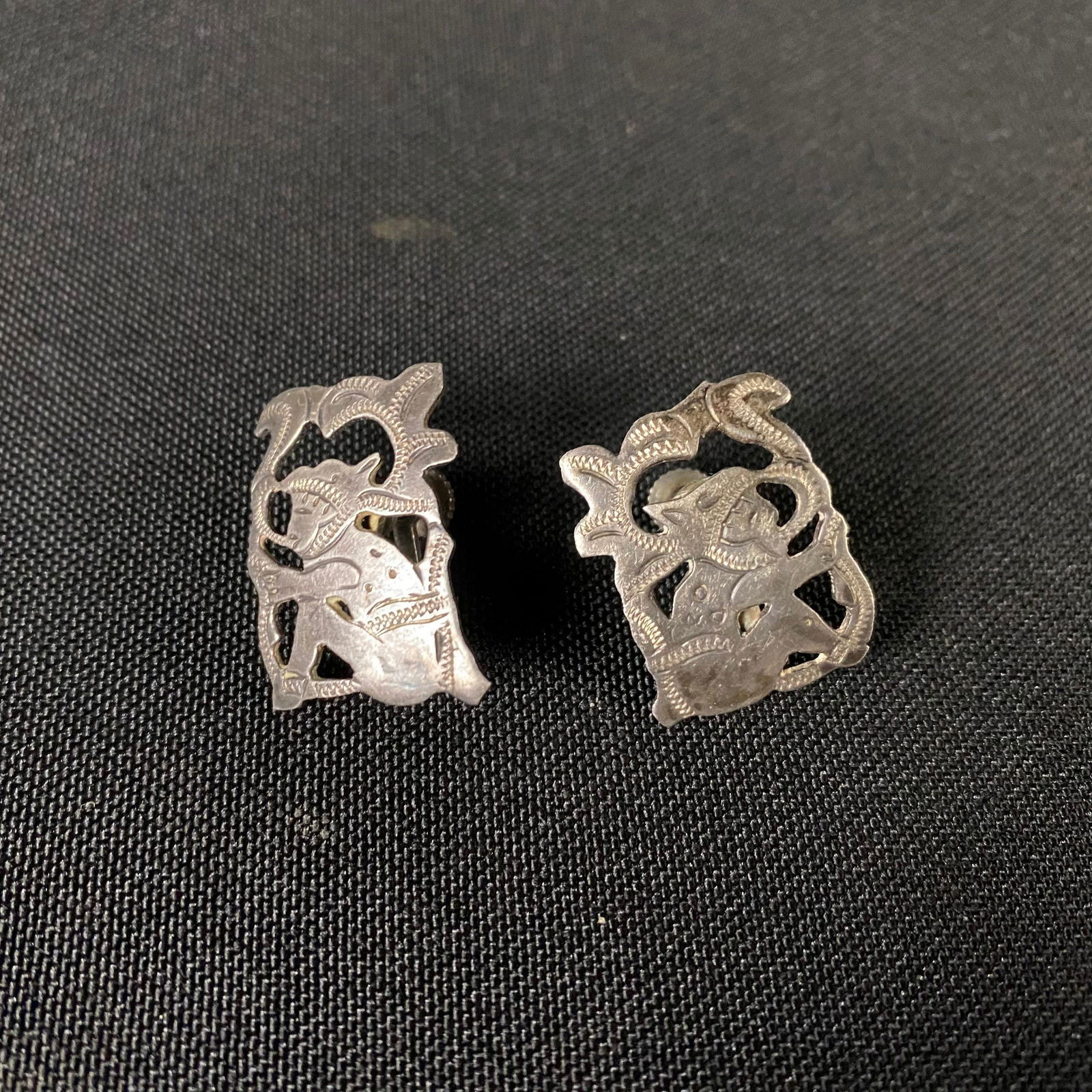 Sterling Silver R&M Silver Guatemala Screw Back Clip on Earrings: Sterling Silver R&M Silver Guatemala Screw Back Earrings. Condition is Great with minor surface wear, and slightly more moderate wear on one of the two pieces near the face of the Tribesman. The Earri