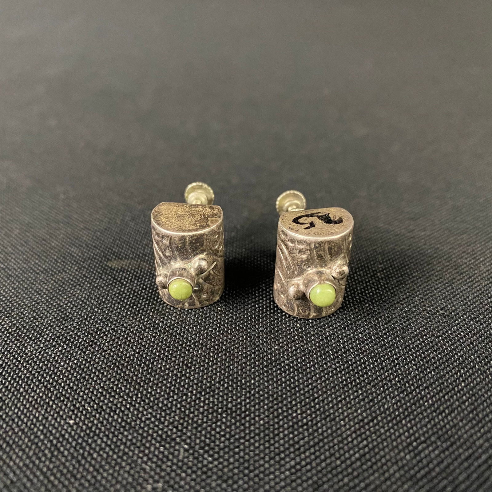 Sterling Silver Stylized Cactus Screw Back Earrings with Small Green Stone: Sterling Silver Stylized Cactus Screw Back Earrings with Small Green Stone. Condition is Excellent with no damage and minor surface wear. They have a cylindrical body with a flat back where the screw