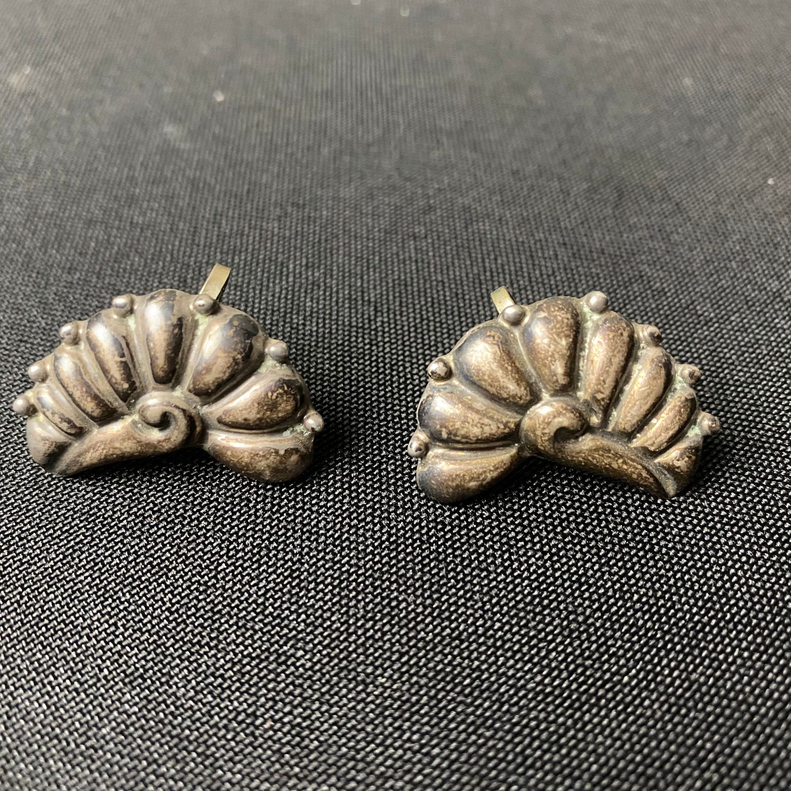 Sterling Silver Segmented Shell-like Designed Screw Back Earrings: Sterling Silver Segmented Shell-like Designed Screw Back Earrings. They are in excellent condition with minor surface wear and grime. They have a shell-like design with silver beads on the outer edge