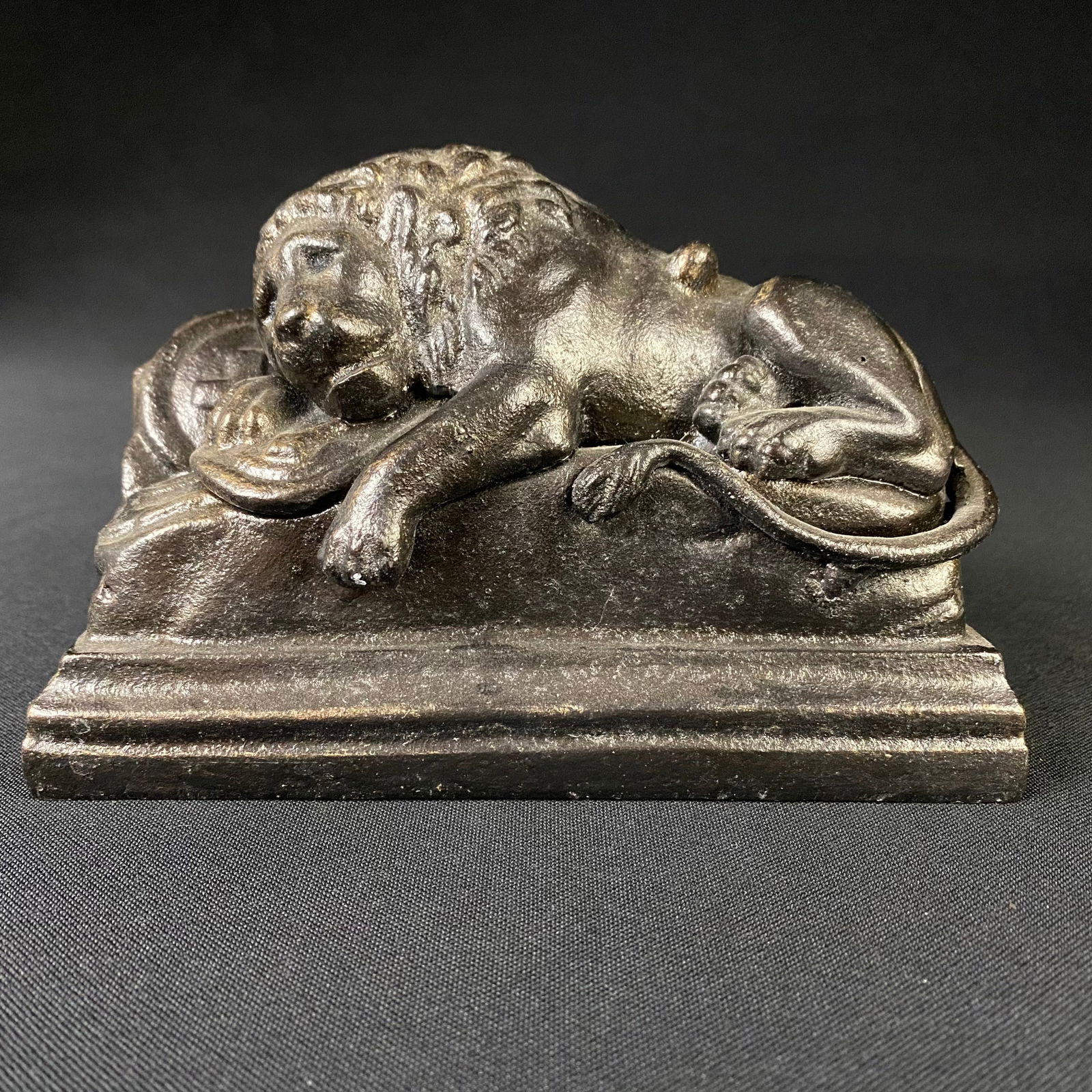 Cast Iron Lion of Lucerne: Cast Iron Lion of Lucerne. It is in excellent condition with no damage except for some minor wear to the finish on the back edge. The base of the casting is hollow and without a solid back or bottom,