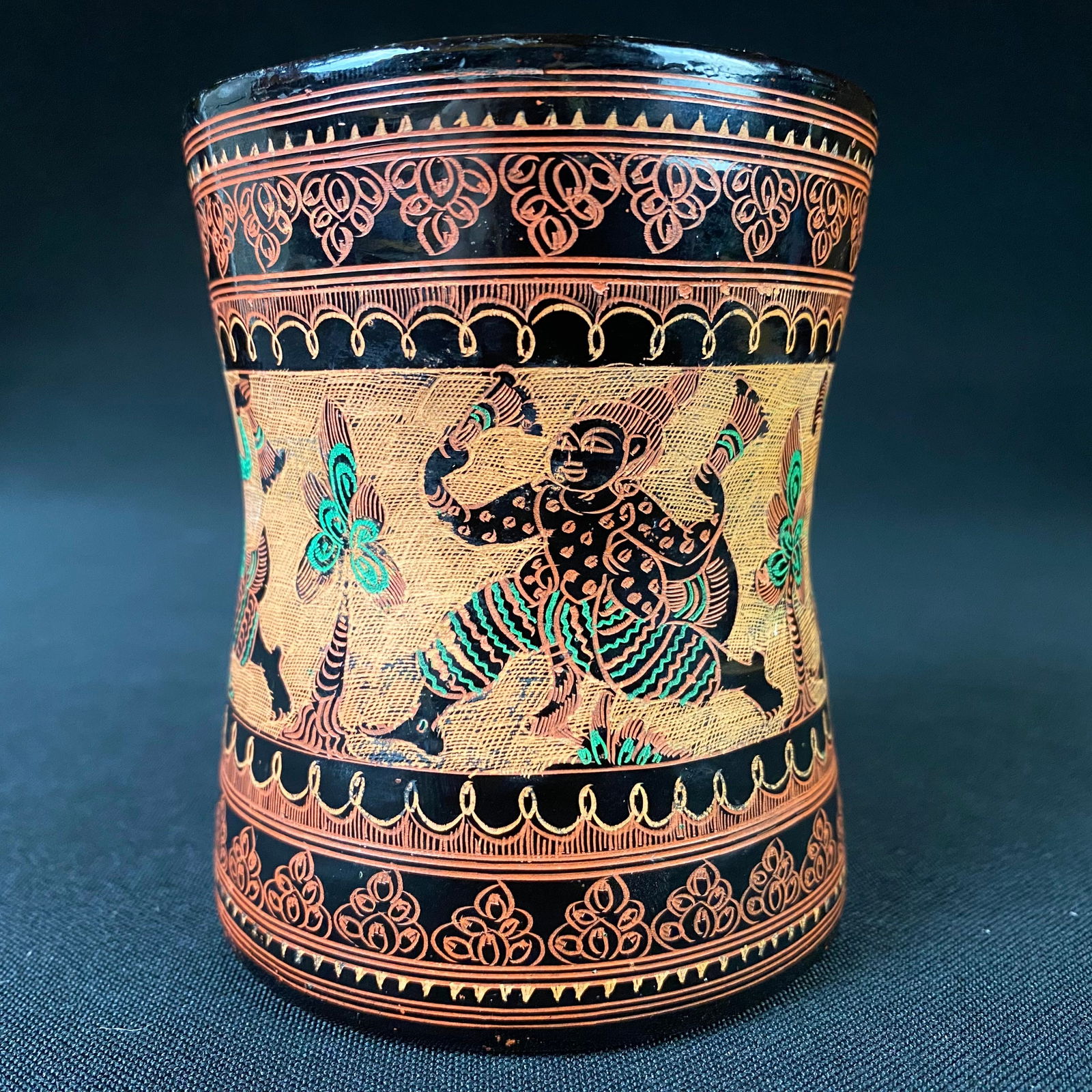 Vintage Hand Carved Oriental Lacquered Bamboo Cup: Vintage Hand Carved Oriental Bamboo Cup. It is in excellent condition with some surface wear and grime, as well as some tape residue on the inside of the cup. It Is detailed with what appears to be wo