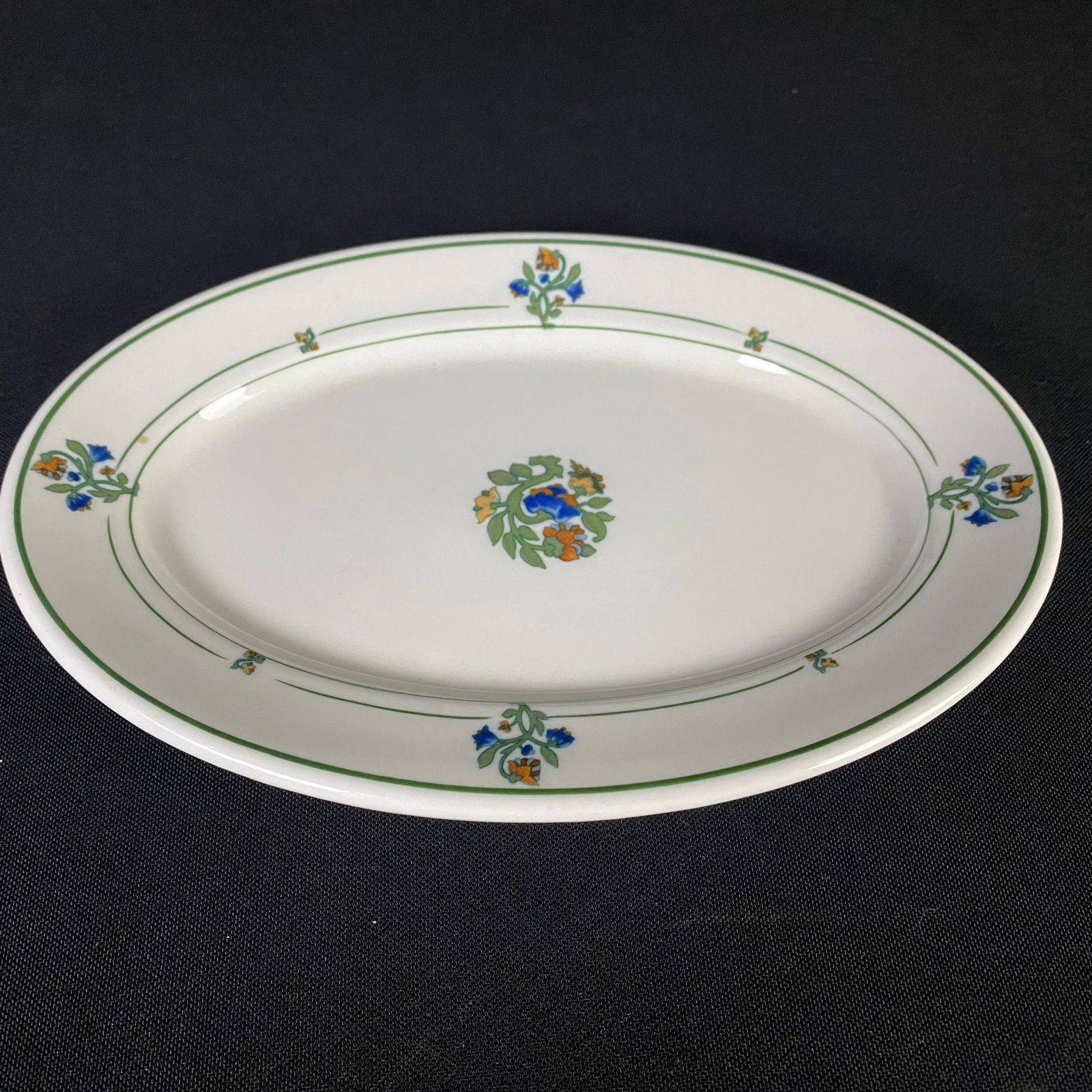 St. Albans O.P.CO. Syracuse China H-4 Missouri Pacific Oval Plate.: St. Albans O.P.CO. Syracuse China H-4 Missouri Pacific Oval Plate. Condition is excellent with minimal surface wear and grime. It has a white glaze base with green lining and foliage with blue and ora