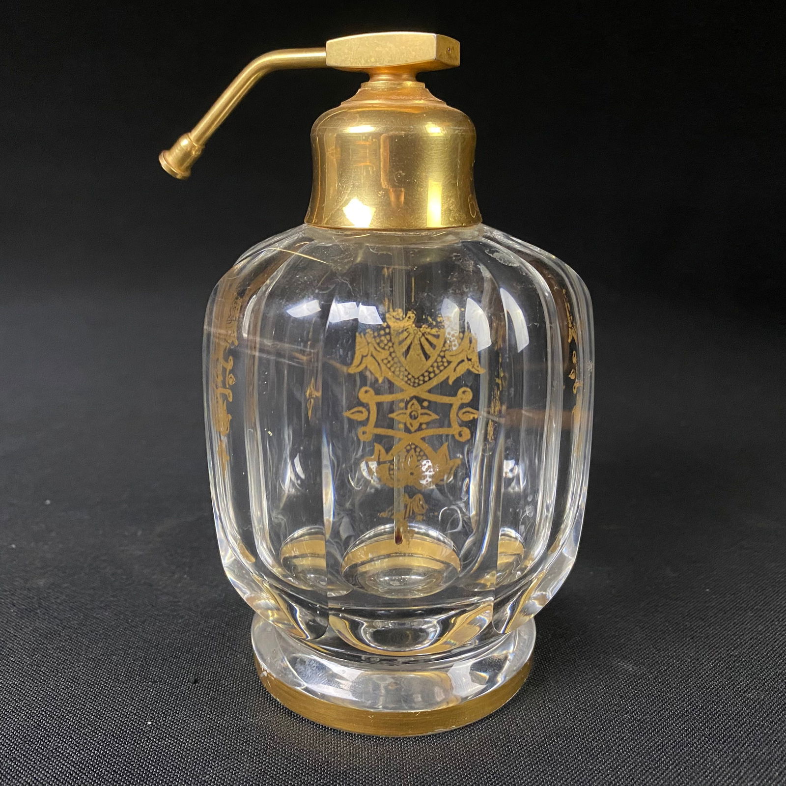 Vintage Crystal Baccarat Perfume Bottle Gold Gilt Design from France with Brass Atomizer Spritzer: Vintage Crystal Baccarat Perfume Bottle Gold Gilt Design from France with Brass Atomizer Spritzer Nozzle Top. It is in good condition, with no cracks, breaks or chips, and moderate surface wear includ