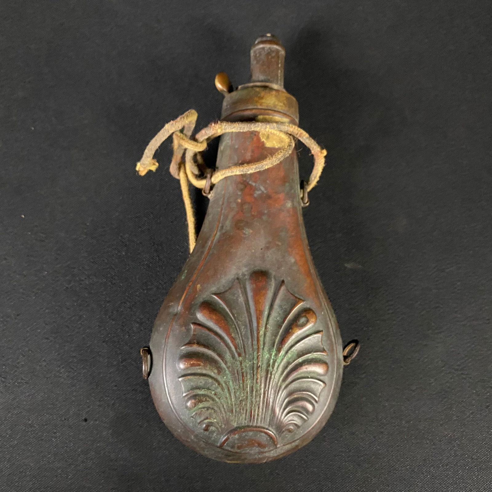 Antique Brass Muzzleloader Powder Flask: Antique Brass Muzzleloader Powder Flask. It is in Great condition and has a fabulous patina. There are a few dents to the body, but no breaks, and the opening mechanism operates properly. There appear