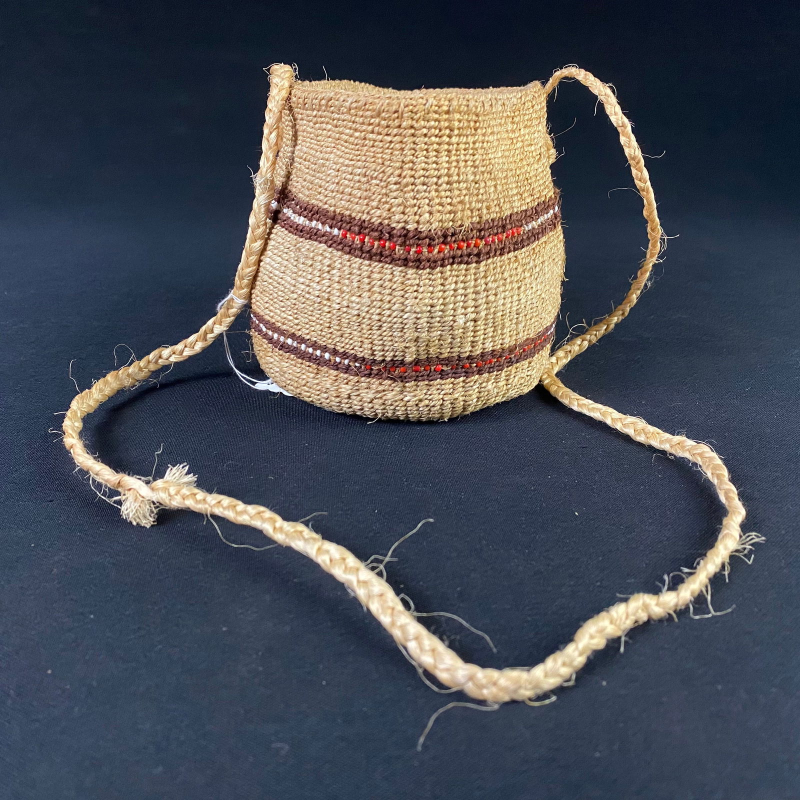 Hand Made Natural Fibers Pouch with Strap: Hand Made Natural Fibers Pouch with Strap. Condition is great with no major damage to the pouch or the strap. There is minor fraying to the fibers throughout the piece, but it is in great structural s