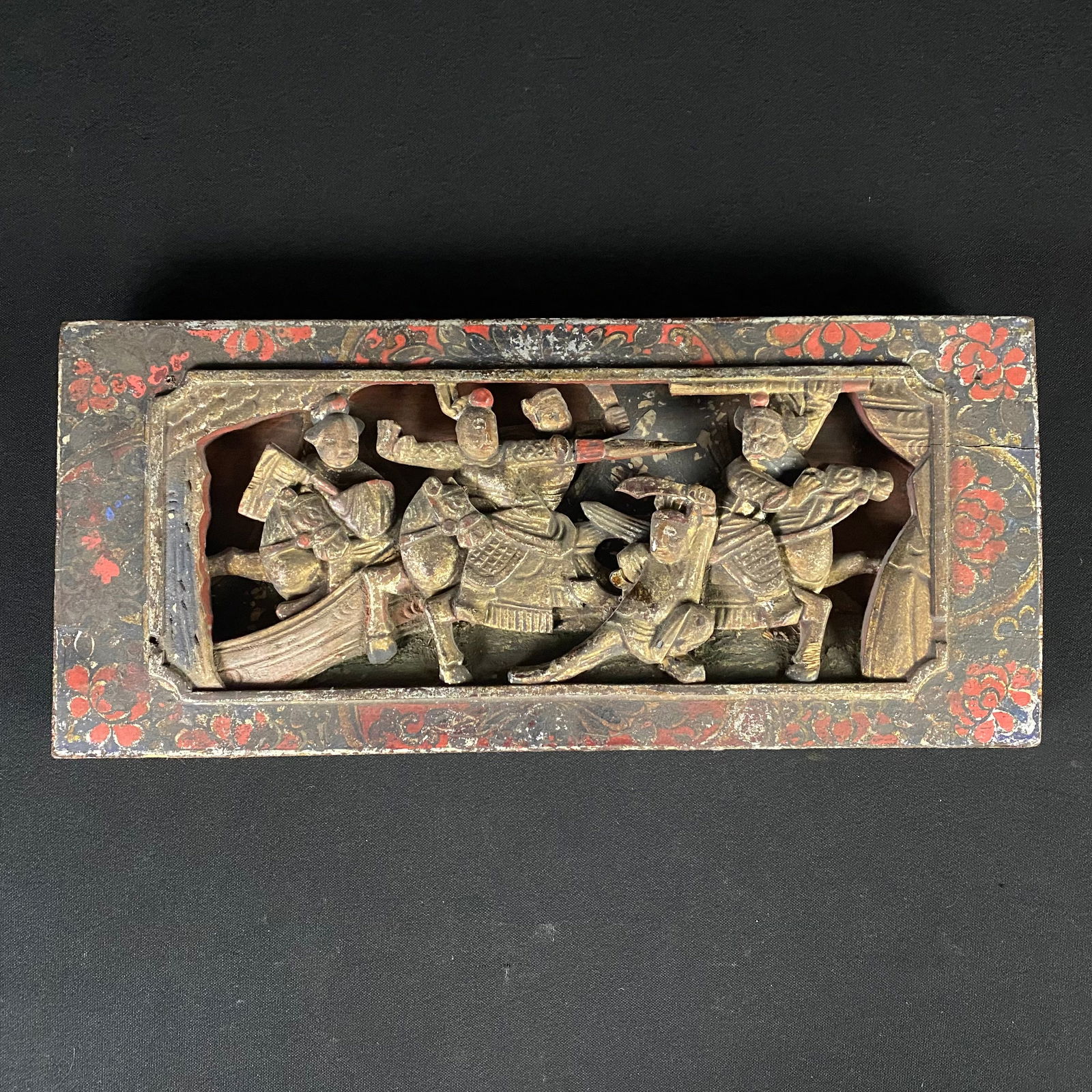 Early 20th Century Chinese Hand Carved Red and Black Lacquered Giltwood Panel: Early 20th Century Chinese Hand Carved Red and Black Lacquered Giltwood Panel. Condition is good, used, with minor wear appropriate with age. The Lacquer is word through in areas as well as the gold g