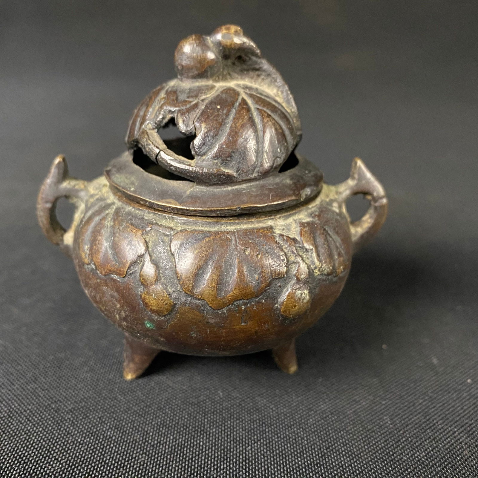 Antique 19th Century Cast Bronze Incense Burner with Large Leaf and Fruit Designs: Antique 19th Century Cast Bronze Incense Burner with Large Leaf and Fruit Designs. Condition is good, used. It has some damages, and wear appropriate with age. There are two small cracks and a small c