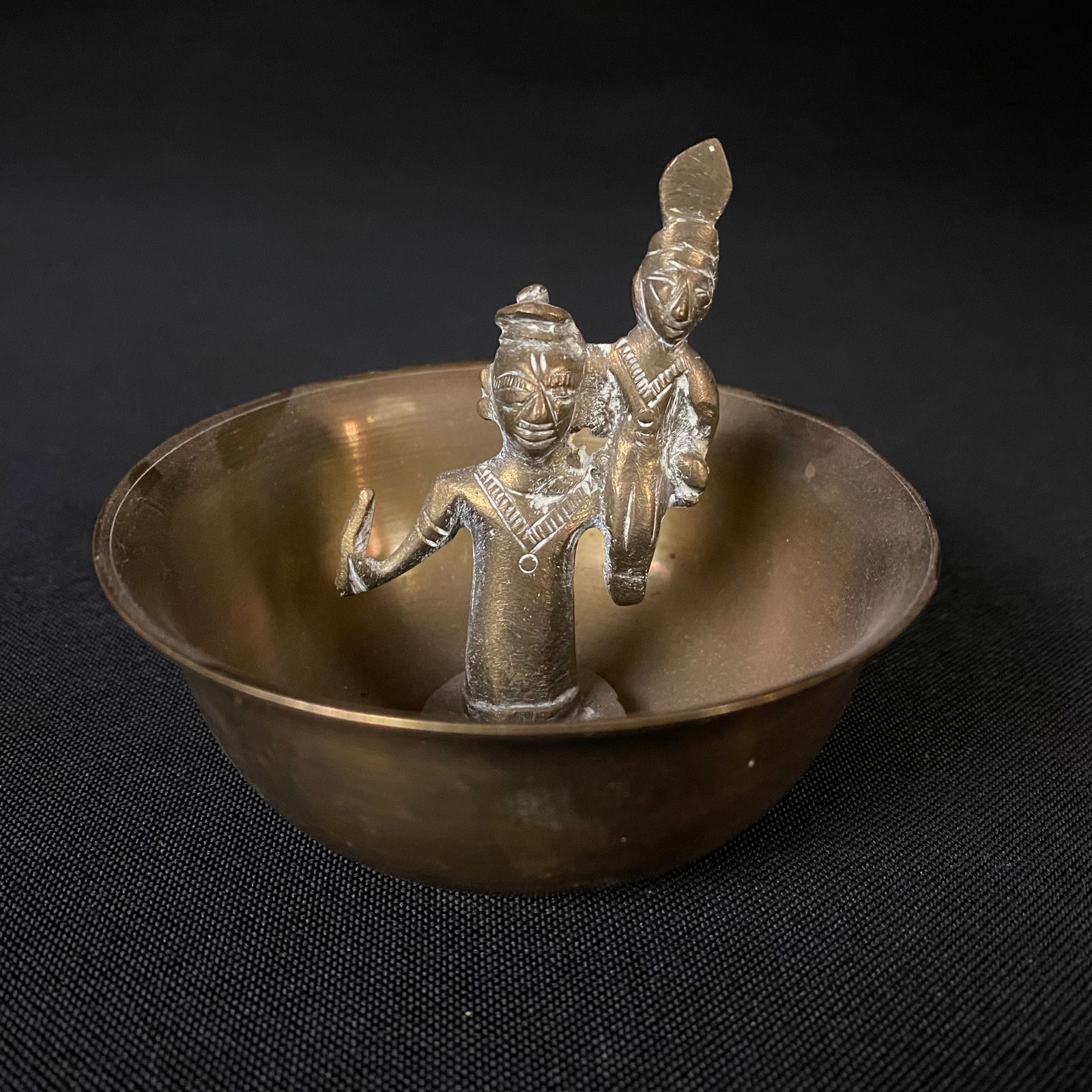 Vintage Asian Hand Made Spun Brass Incense Bowl with Cast Buddhist Sculptural Grouping: Vintage Hand Made Spun Brass Bowl with Cast Brass Center Statuette. Condition is good, used. There is no major damage, but there is some waviness to the brim of the bowl, and the statuette sits askew