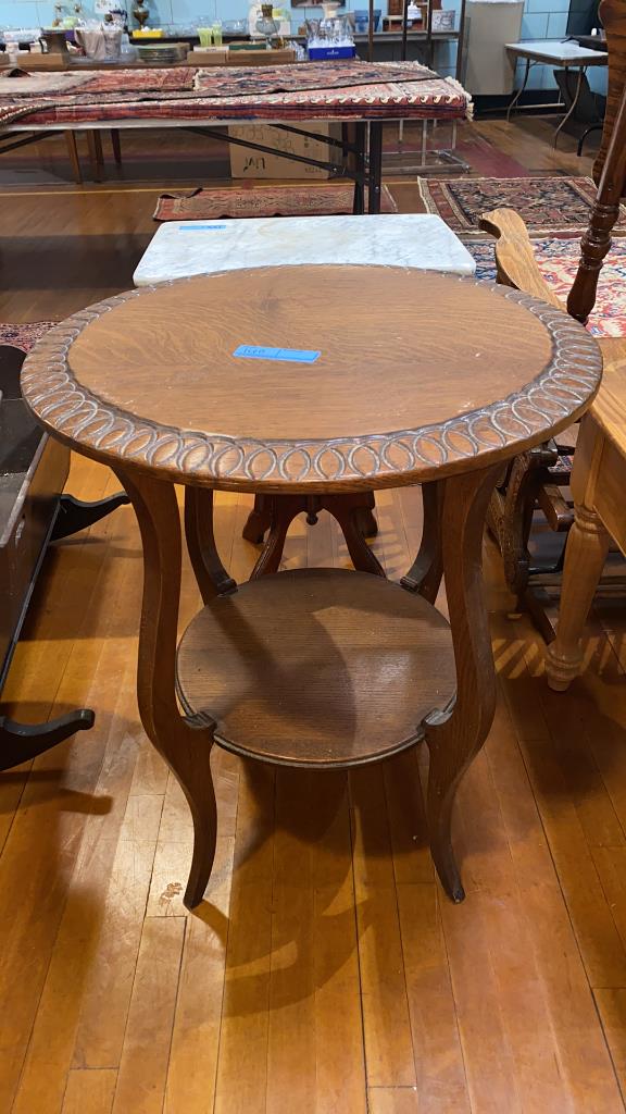 CARVED ROUND OAK TABLE: 23.5" X 29” TALL