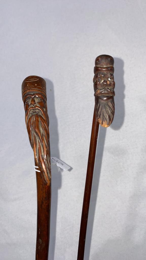 2 WALKING STICKS W/CARVED HEADS (1 of 3)