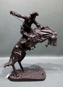 SIGNED BRONZE STATUE OF BUCKING BRONCO & COWBOY