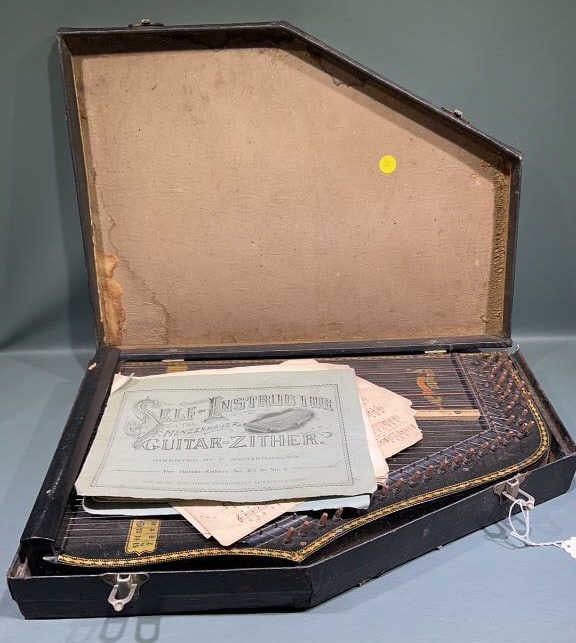 MENZENHAUER GUITAR-ZITHER W/ CASE & BOOKLET: ~ 20" X 15" (all sizes are approximate for shipping calculations for detailed sizes please contact us)