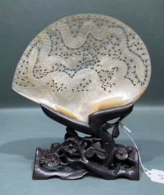 ORIENTAL CARVED SHELL ON WOOD CARVED BASE