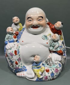 CHINESE PORCELAIN FIGURE OF LAUGHING BUDDHA