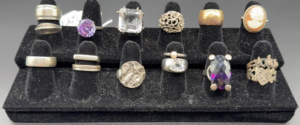 COLLECTION OF 16 STERLING RINGS: ~
