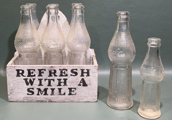 SMILE ADVERTISING 6 PACK OF 2 1/2 FL OZ BOTTLES: WITH 2 OTHER BOTTLES ~ CASE IS 5 3/4" X 4 1/2" X 6 1/4"
