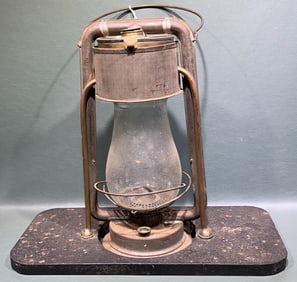 ANTIQUE DEITZ LANTERN ON FOOT WARMER