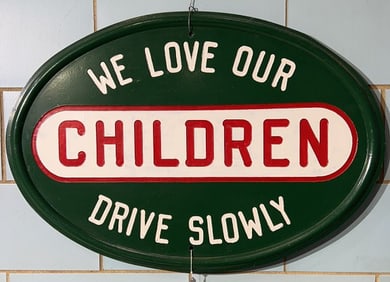 CAST IRON "WE LOVE OUR CHILDREN DRIVE SLOW" SIGN