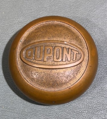 VINTAGE DUPONT BRASS PAPER WEIGHT: 2 1/4"