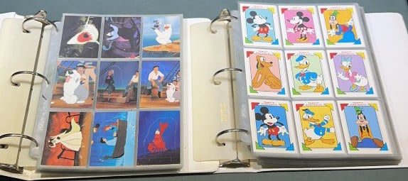 2 BINDERS FULL OF DISNEY TRADING CARDS: Each binder measures 11 1/4" x 11 1/2"