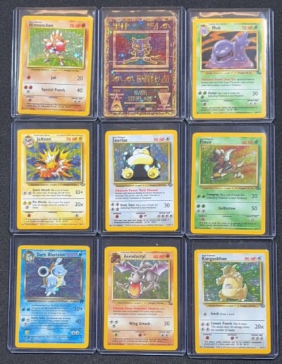 (9) VINTAGE HOLO POKEMON CARDS: In penny sleeves and top loaders. Each case measures 3" x 4".